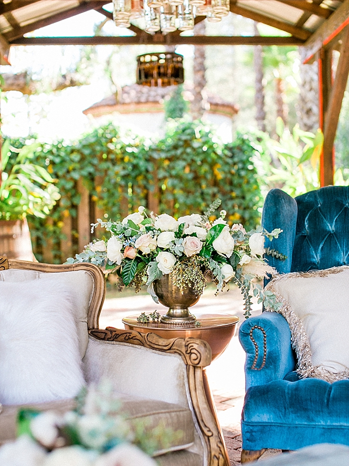 Full and luscious centerpiece in a pedestal vase | Photo by Dennis Roy Coronel | See more on thesocalbride.com