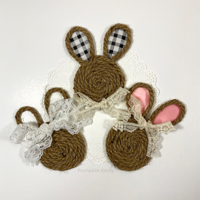 Three rope bunnies with ribbon and lace.