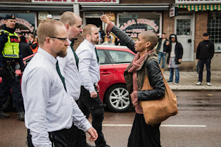 http://www.jpost.com/Not-Just-News/Photo-of-lone-woman-standing-against-marching-neo-Nazis-in-Sweden-goes-viral-453407
