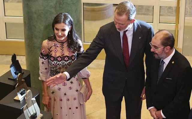 Queen Letizia wore a Finale eggshell floral embroidery tulle midi dress by Temperley London. Tous Beethoven earrings