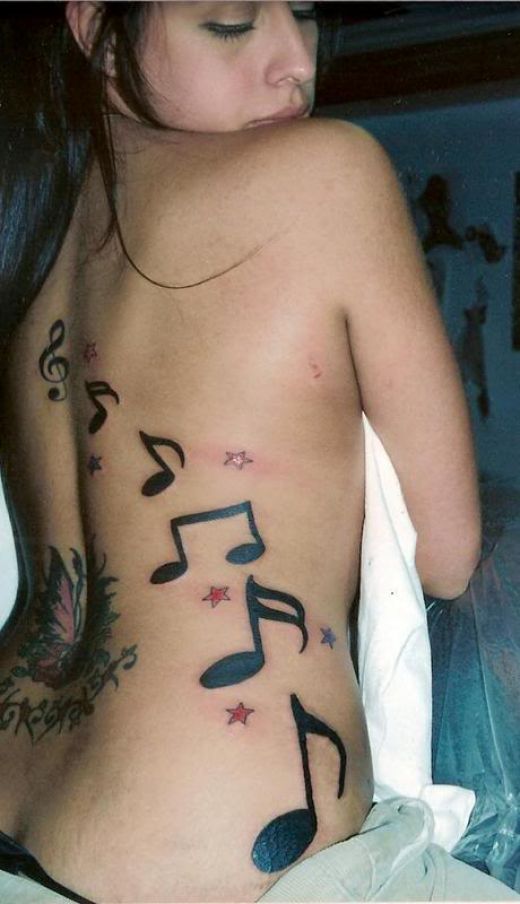 Deff the best of moi music note tattoos so far love this chicks tattoos 