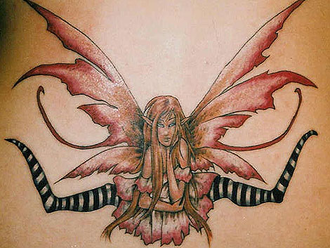 Perfect Sexy Girl With Tribal Butterfly Tattoo On The Lower Back Tattoo