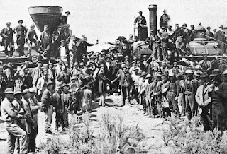 Utah on May 10, 1869; completion of the First Transcontinental Railroad. At center left, Samuel S. Montague, Central Pacific Railroad, shakes hands with Grenville M. Dodge, Union Pacific Railroad (center right).