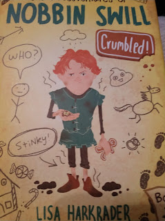 cover art showing a boy with red hair and a green tunic and the words "Nobbin Swill" and "Crumbled by Lisa Harkrader"