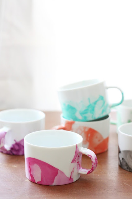 http://diycandy.com/2015/04/diy-marbled-mugs-with-nail-polish/
