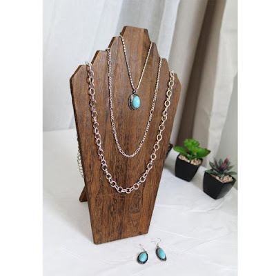 Wooden Jewelry Display Bust Easel in Brown displaying a silver turquoise necklace