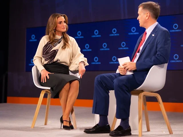 Queen Rania wore a new graphic print blouse by Fendi, and black suede pumps by Jennifer Chamandi