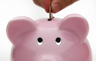 Deposit Into Piggy Bank Savings Account</a> by Ken Teegardin via Wikimedia Commons - https://commons.wikimedia.org/wiki/File:Deposit_Into_Piggy_Bank_Savings_Account_(6093700157).jpg