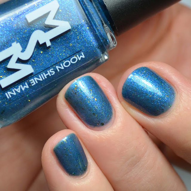 smoky blue nail polish with color shifting flakies swatch