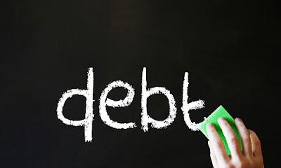 4 Reasons Why Debt Affects a Relationship Negatively board writings black and whote erase words