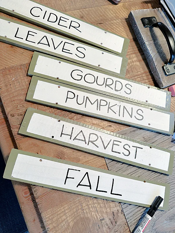 hand lettered signs and a marker