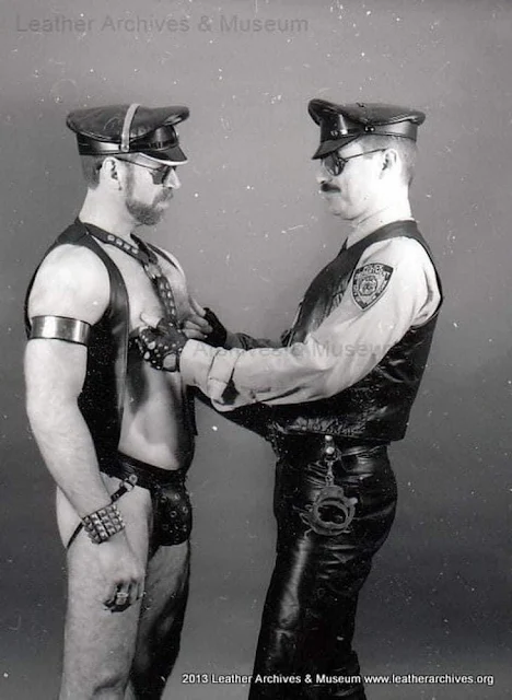 Two leather men wearing gear and black and white photo