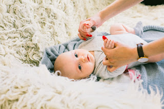 Image: Baby in Onesie Lying on Fur, by Daria Shevtsova on Pexels