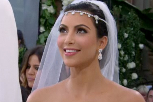 Kim's wedding day makeup was simple yet elegant and was done by her long