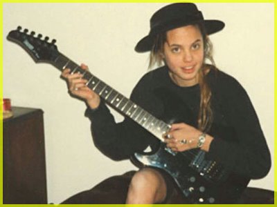 Who ever knew young Angelina Jolie could play the electric guitar that well