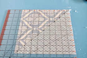 Learn to square a quilt block using any ruler and a cutting mat. No special square rulers needed! 