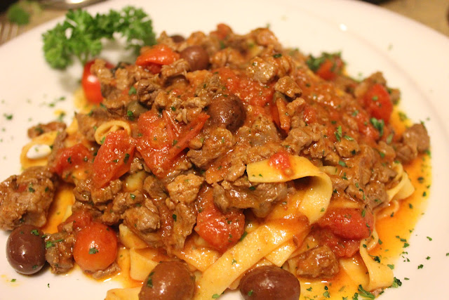 Pasta with filet, tomatoes, capers, and olives