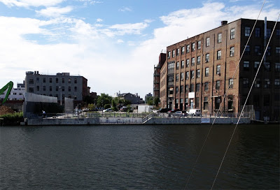 Looking at bulkhead and park on Brooklyn side of industrial waterway from Long Island City, Queens