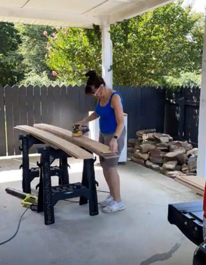 Me sanding all of the shiplap boards