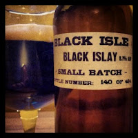 Black Islay beer bottle and glass