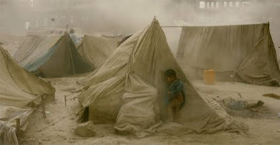 An Afghan Refugee Child Hides From a Dust Storm