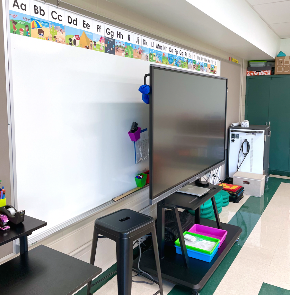 First grade classroom setup, this photo features an alphabet line, standing desk and clear touch panel