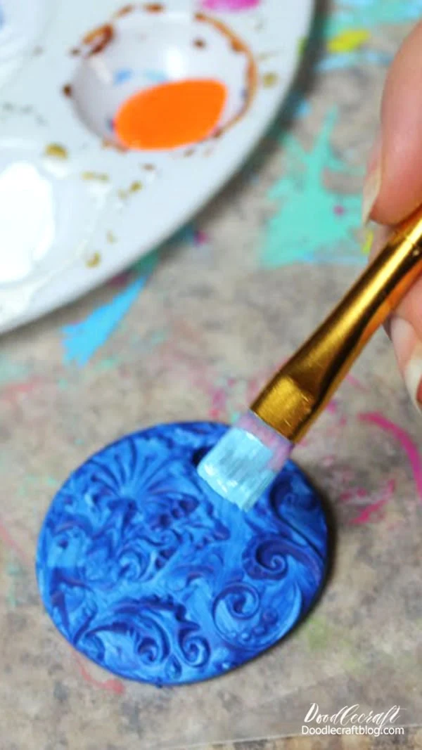 Start by painting the pendant lightly in one color of paint.