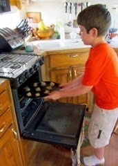1308240 Aug 28 Nate Puts Cookies In Oven