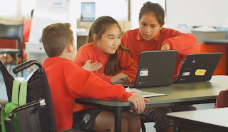 Students working on laptops