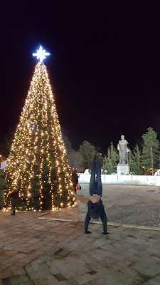 Plaza Hristo Botev, ice skating, and two pinos  (pino is Spanish for "pine tree" and "handstand")