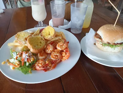 " Shrimp platter with fries and the chicken burger from het Pannekoek & Poffertjes cafe in Paramaribo"