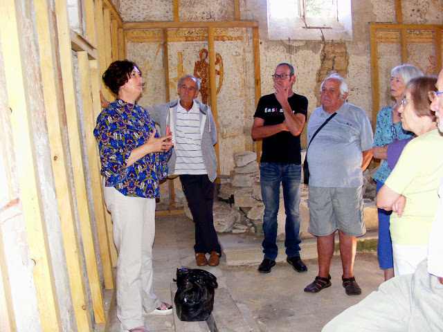 Conservator talking about wall paintings, Indre et Loire, France. Photo by Loire Valley Time Travel.