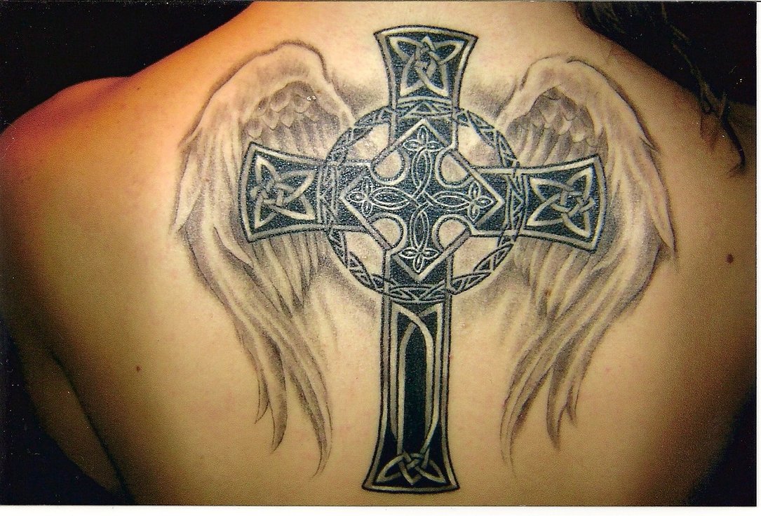 angel wings with letter tattoo