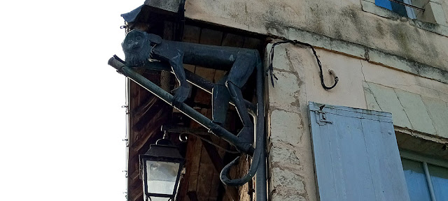 Copper monkey by Paule Richon attached to a downpipe, Indre et Loire, France. Photo by Loire Valley Time Travel.