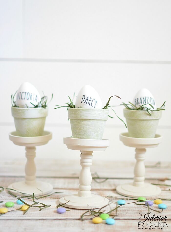 Gorgeous budget-friendly Rae Dunn inspired Easter egg place card holders with French Country style with repurposed dollar store mini terracotta pots.