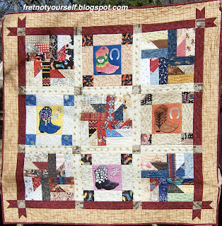 The Puddin' and Pie blocks are alternately set with Boot blocks to create this nine-block baby quilt.