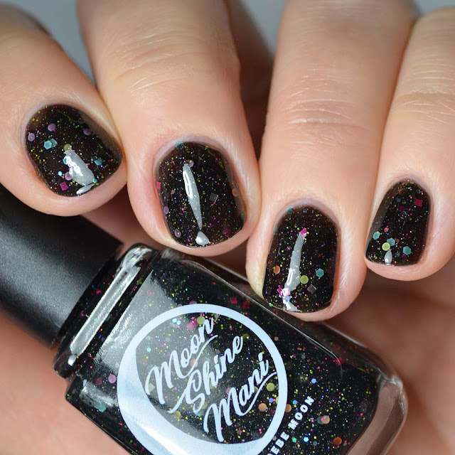 black nail polish with rainbow glitter swatch