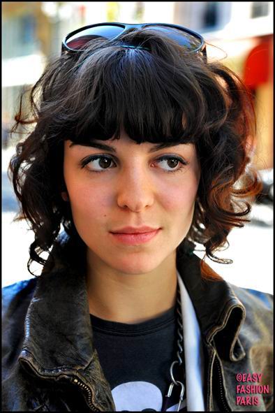 Medium Wavy Cut with Bangs. medium black wavy hairstyle