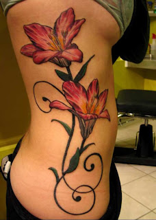 Tattoo flowers in the perfect female body