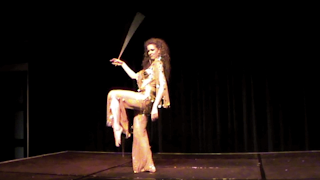 Galit Mersand bellydancing with stick, cane