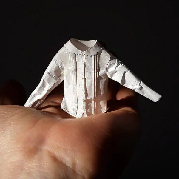 tiny white button-up shirt made of paper