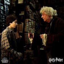 Olivender is giving a wand to Harry Potter.