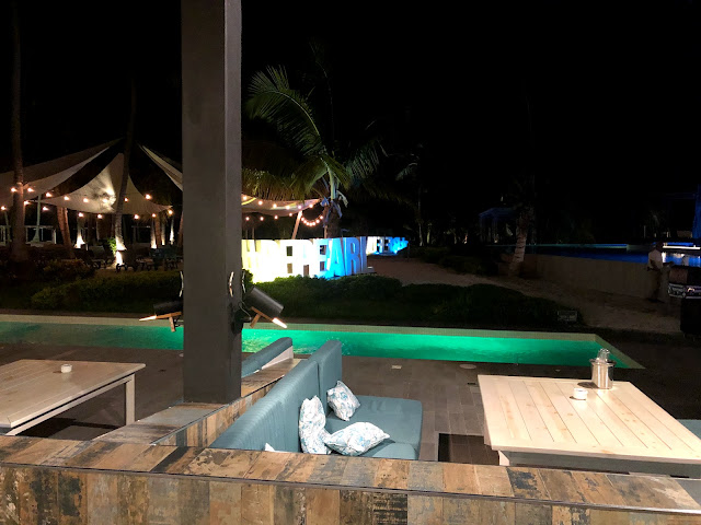 View from our booth at night. A pool is illuminated