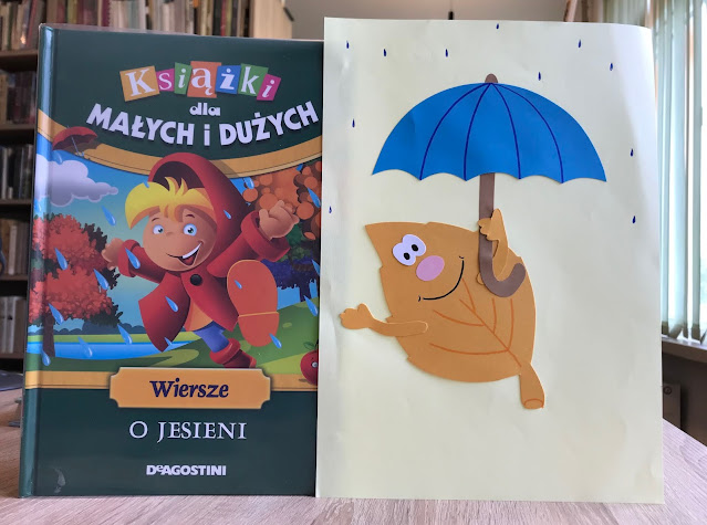 Na zdjęciu książka "Wiersze o jesieni" oraz obrazek z liściem pod parasolem, który wykonywały dzieci