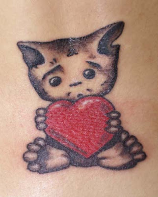 kitten with heart tattoo