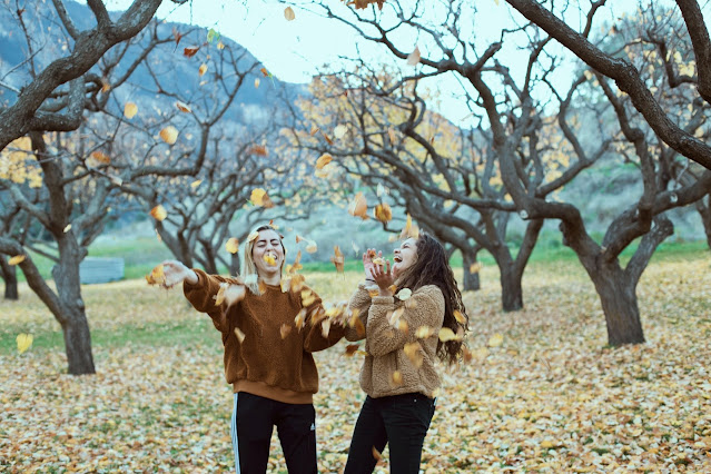 women in an autumn orchard