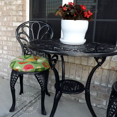painted wrought iron table and chair