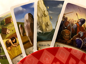 A hand of five Timeline cards in a card holder.