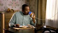 Man using soup-can telephone in a Progresso TV ad