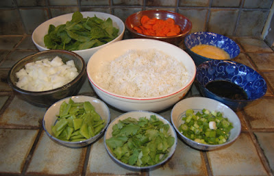 The prepped ingredients for vegetable fried rice.